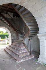Spiral Stone Staircase Inside Historic Archway of Old Cemetery Courtyard, Weathered Stone Architecture Ancient Monument