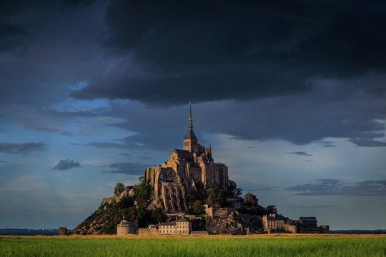 abbey mont-saint-michel in the last light of sunset