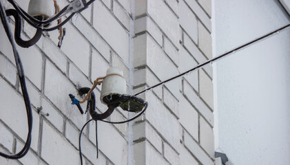 Electric power lines covered in ice and icicles after freezing rain. Winter