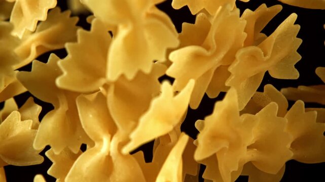 Super slow motion flying dry farfalle pasta . Filmed on a high-speed camera at 1000 fps. High quality FullHD footage