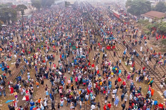 Tongi, Bangladesh - 12 January 2020: Aerial view of a dense crowd thronging the railway tracks near Tongi Rail Station Road, a vibrant tapestry of humanity.