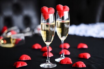 Valentine&rsquo;s Day Love Concept with Champagne Glasses and Red Hearts on Black Background.