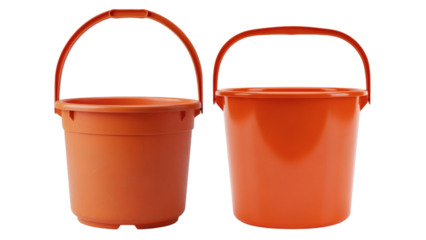 Two orange plastic pails with arched handles sit side-by-side, their smooth surfaces highlighted against a dark background