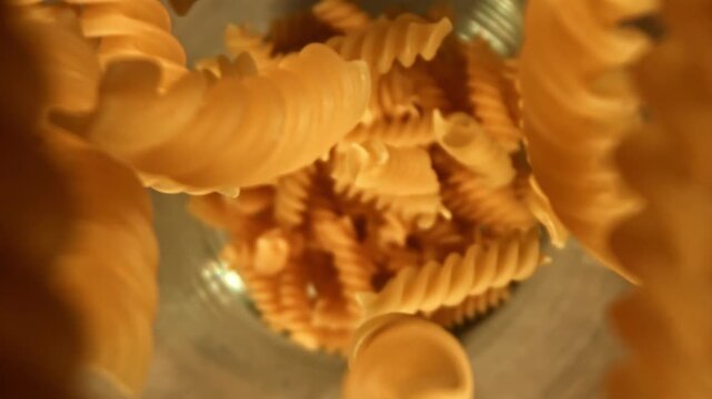 Super slow motion fusilli pasta dry . Filmed on a high-speed camera at 1000 fps. High quality FullHD footage