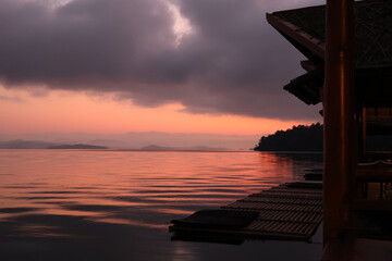 Sunset in the evening at the river, casting twilight color on the cool and peaceful water