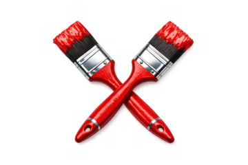 Cross paintbrushes with red paint, illustrating creativity, home renovation, art, and diy decoration concepts