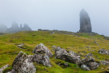 Old Man of Storr rising from misty hillside Isle of Skye Scotland