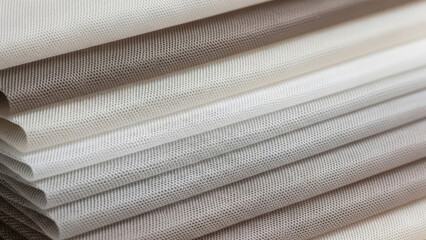 A close-up of tulle fabric samples soft transparent textile background. Image can be used for interior design, fashion materials, sewing concepts, and textile industry themes.