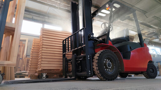 Manipulator lifting elevator loader in the workshop industrial environment