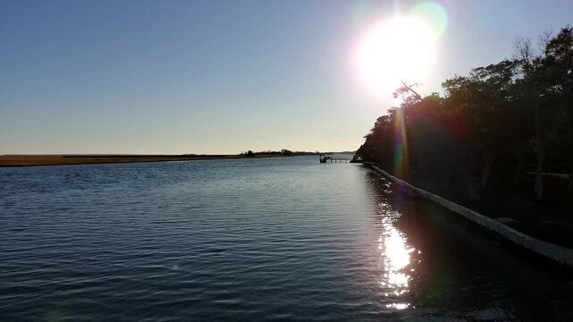 Drone clip of slow ascension over the intercostal waterway in South Carolina just before sunset.
