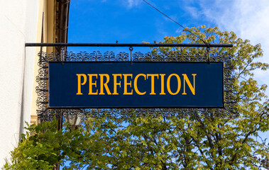 Perfection symbol. Concept word Perfection on beautiful black road sign. Beautiful blue sky and street in Brugge background. Business perfection concept. Copy space.