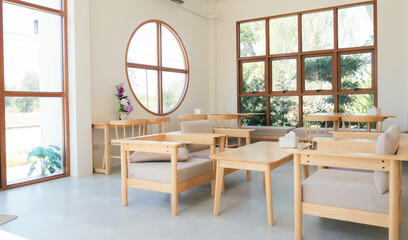 Natural light streaming through the windows, creating a peaceful cafe atmosphere.