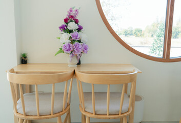Natural light streaming through the windows, creating a peaceful cafe atmosphere.