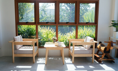 Natural light streaming through the windows, creating a peaceful cafe atmosphere.