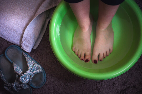 Woman's feet in warm water