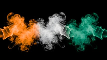 Vibrant orange white and green smoke plumes on black background. India republic day celebrations with tricolor smoke on black background