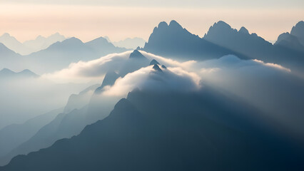 Dramatic light rays hitting mountain slopes through breaking clouds in dark moody landscape