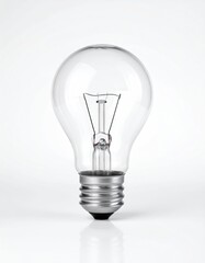 Clear glass bulb on white surface, isolated studio shot.