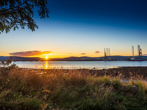 Sunset over Cromarty Firth and oil rigs in Dingwall Scotland