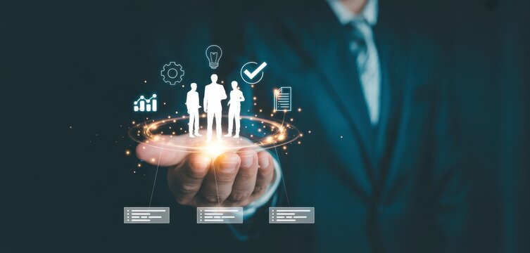 Human resource and team management concept with businessman holding digital team icon, representing employee data system, workforce management, business connection, leadership and talent analytics.