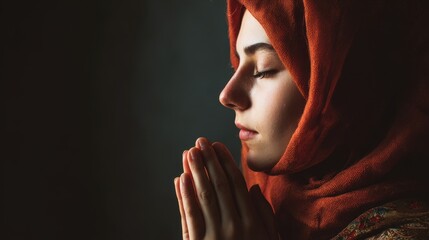 young Muslim woman praying to God