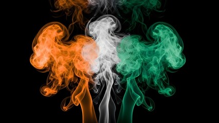 Vibrant orange white and green smoke swirls on black background. India republic day celebrations with tricolor smoke on black background.
