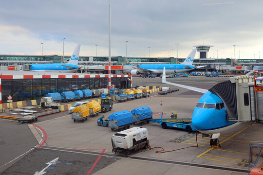 AMSTERDAM 09 08 2024: KLM plane being loaded at Schiphol Airport. There are 163 destinations served by KLM many are located in the Americas Asia and Africa
