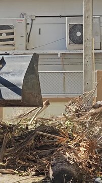 Heavy Machinery at Work: A construction scene showcases a powerful piece of machinery, diligently clearing debris. The image captures the essence of efficient work.