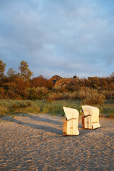A few beach chairs alone on the beach on the Dar&szlig; Peninsula, Germany, vertical view