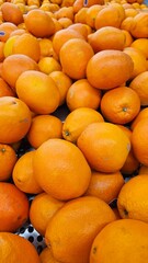 Citrus Pile: An array of ripe oranges fills the frame, showcasing the bright colors and textures of this popular fruit.
