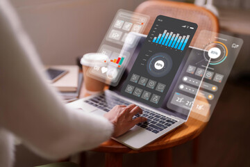Business analyst using laptop with futuristic dashboard UI to monitor data analytics and key performance indicators for strategic financial growth data visualization fintech