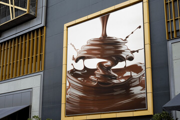 A studio photograph of melted Malik chocolate cascading in a dynamic splash  - 8 © sonia