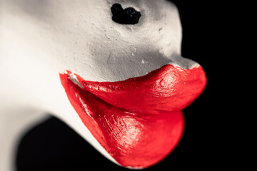 Toy red painted lips closeup. Lip augmentation concept
