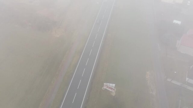 Residential area in thick fog with mp4ing vehicle