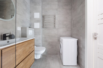 modern bathroom room with toilet and washing machine