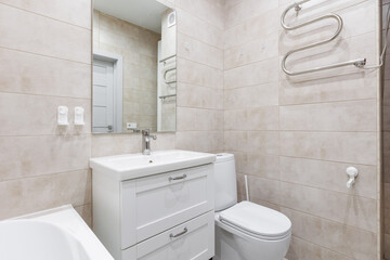 modern bathroom room with toilet and washing machine