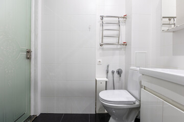 modern bathroom room with toilet and washing machine