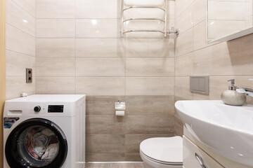 modern bathroom room with toilet and washing machine
