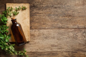 Brown glass bottle placed on wooden table with herbs nearby during daylight