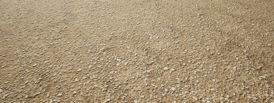 Concept or conceptual brown background  of rough and grunge ground gravel texture floor as a modern pattern layout. A 3d illustration metaphor for construction, architecture and landscape design