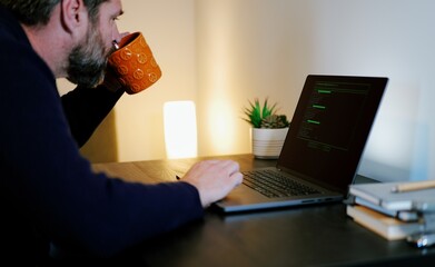 Middle Aged Systems Administrator Engineer Restoring Backups After Ransomware Hacking Attempt - Cybersecurity and Data Protection Concept