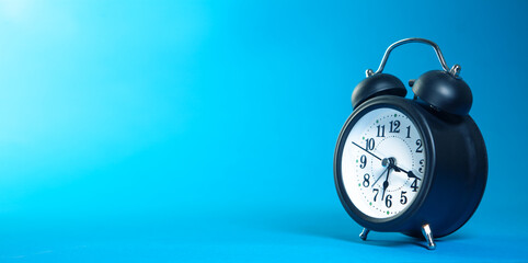 blue clock on a black background