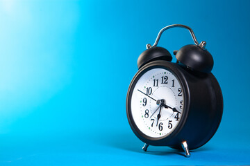 blue clock on a black background