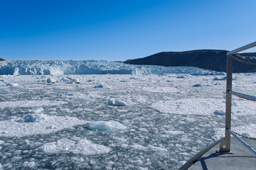 The Mighty Eqi Glacier: A Front View of the Calving Ice Face © Michel
