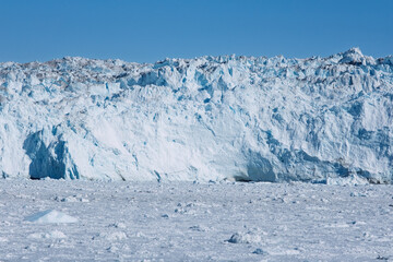 The Mighty Eqi Glacier: A Front View of the Calving Ice Face © Michel