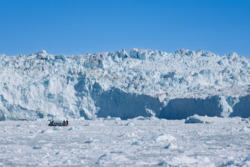 The Mighty Eqi Glacier: A Front View of the Calving Ice Face © Michel