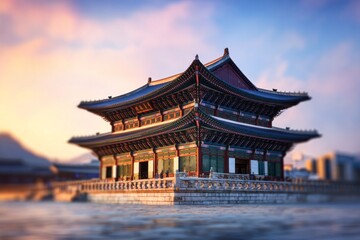 Obraz premium Traditional pavilion with ornate roof sits on stone bridge at sunset.