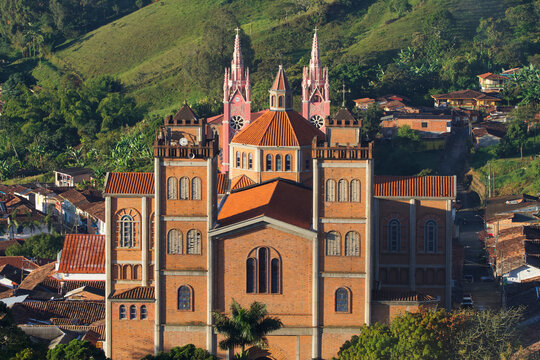 View on the Majestic red-brick "Our Lady of the Mercedes Cathedral" (Nuestra Se&ntilde;ora de Las Mercedes Cathedral) with a pink church behind in the touristic town of Jeric&oacute;, antiquia, Colombia.