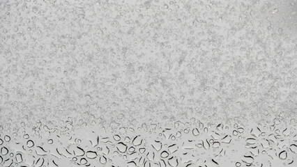 water droplets and snowflakes on the window