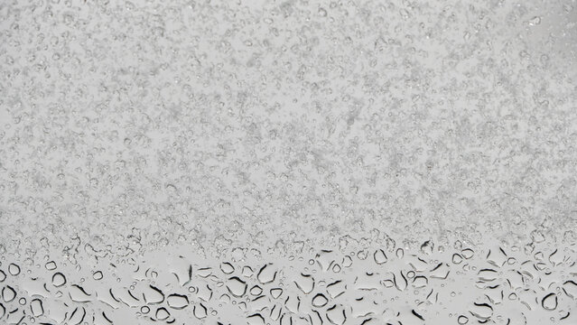 water droplets and snowflakes on the window - Powered by Adobe